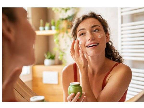 A woman Applying Moisturiser on her face